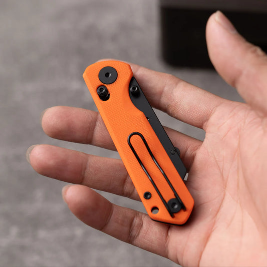 Olitans Adélie Penguin G076 - 2.68" Black Utility Blade, Orange G10 Handle
