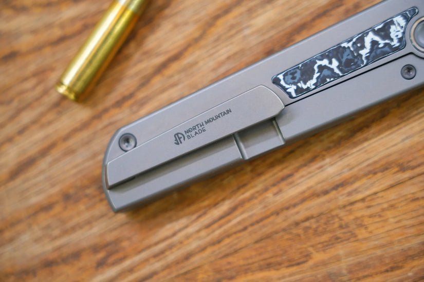 North Mountain Blade Chop Kick Stop Ti - 3.5" M390 Tanto Blade, Titanium with Ceramic Carbon Fibre Inlay Handle