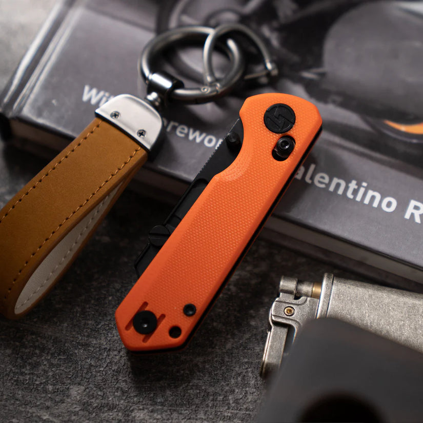 Olitans Adélie Penguin G076 - 2.68" Black Utility Blade, Orange G10 Handle