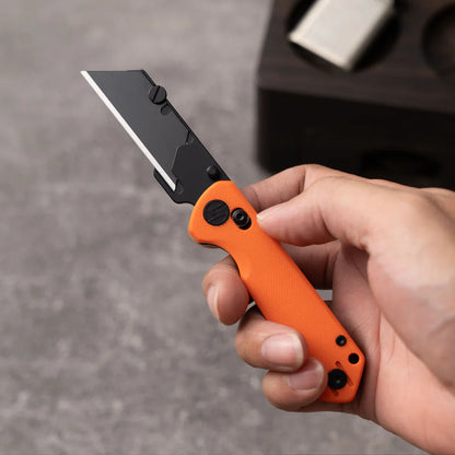 Olitans Adélie Penguin G076 - 2.68" Black Utility Blade, Orange G10 Handle