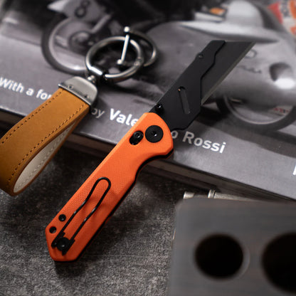Olitans Adélie Penguin G076 - 2.68" Black Utility Blade, Orange G10 Handle