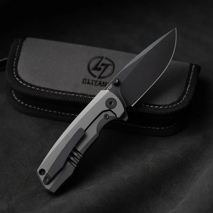 Olitans Bomber T065 - 2.95" M390 Black Stonewashed Blade, Grey Titanium Handle