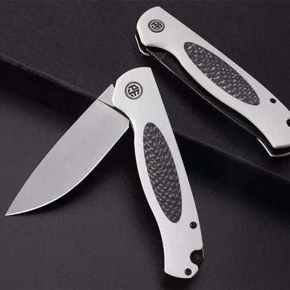 Petrified Fish Stamp PFB03 - 3.58" D2 Black Stonewashed Blade, Black G10 With Carbon Fibre Handle, Flipper