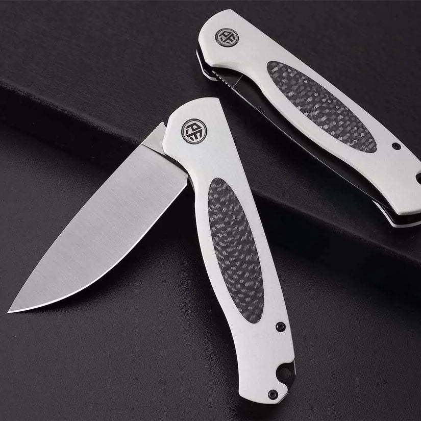 Petrified Fish Stamp PFB03 - 3.58" D2 Black Stonewashed Blade, Black G10 With Carbon Fibre Handle, Flipper